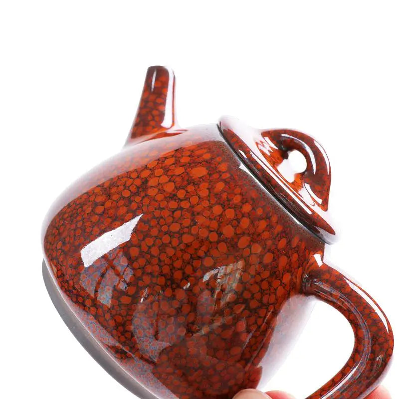 Brown speckled ceramic teapot with glazed texture for gongfu tea brewing from Jianshui red clay