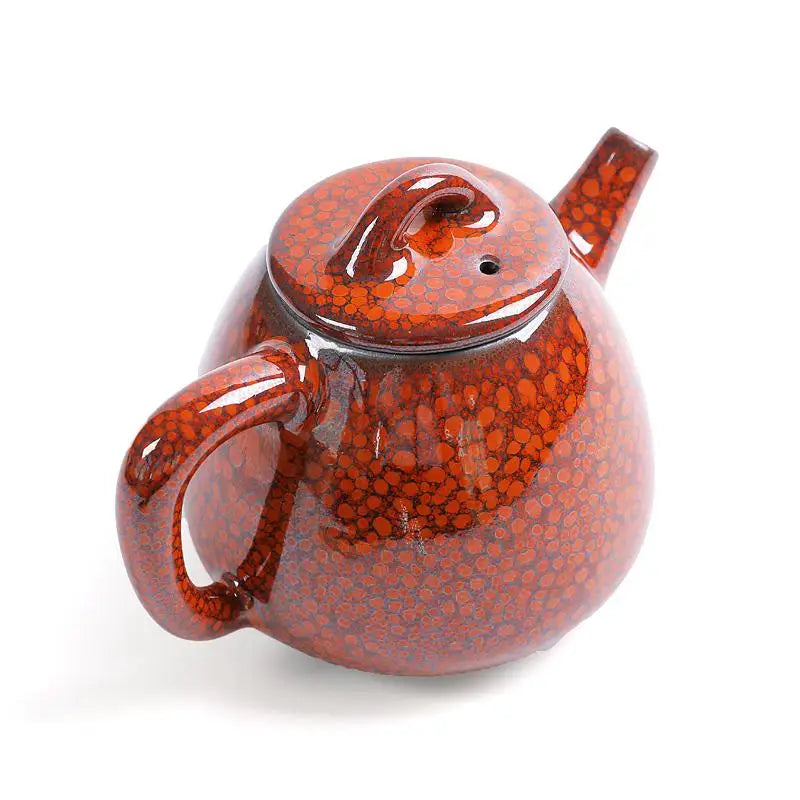 Red-brown ceramic teapot with speckled pattern showcasing jianshui red clay and glazed texture