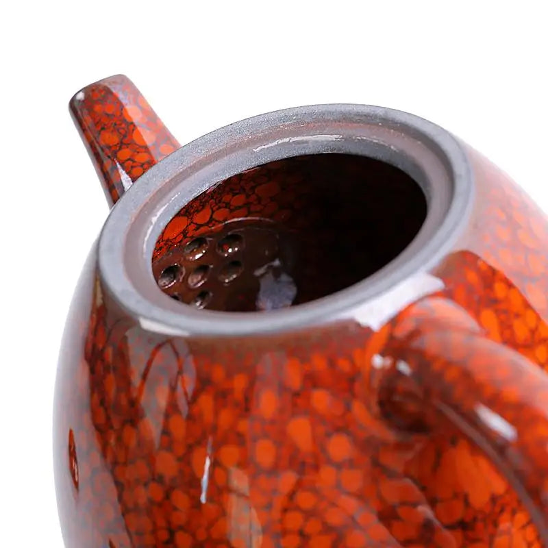 Red and black speckled teapot with glazed texture, ideal for Gongfu tea brewing
