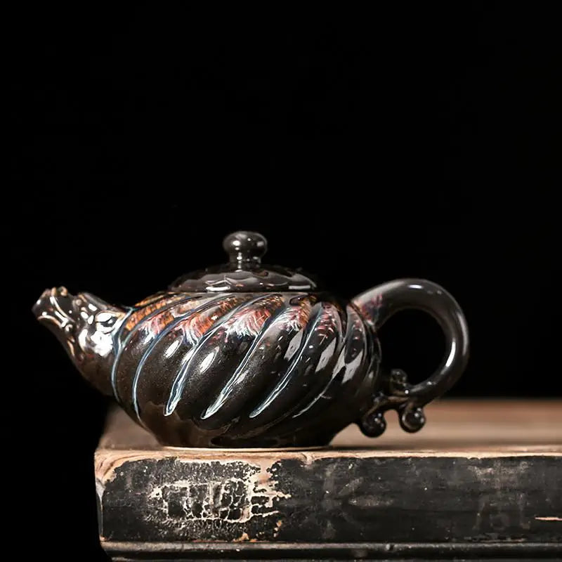 Ornate black ceramic Palm Teapot in jianyang tenmoku glaze for gongfu tea brewing