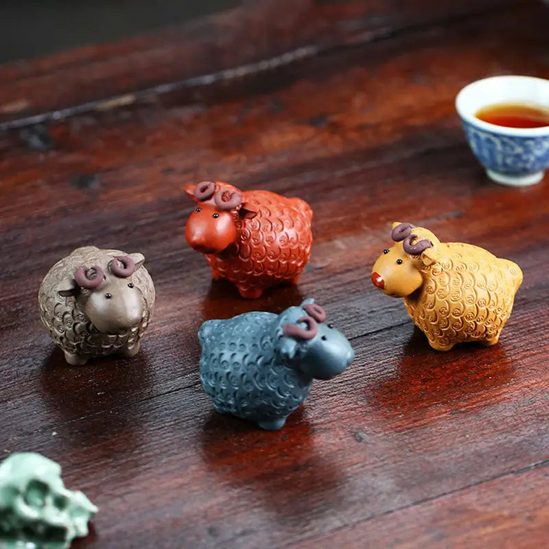 Colorful sheep figurines from Peaceful Ram tea pets guide in Zisha clay for feng shui
