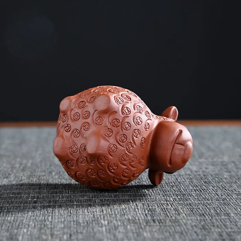 Clay sheep figurine from Peaceful Ram tea pets guide in Zisha clay for feng shui Decor