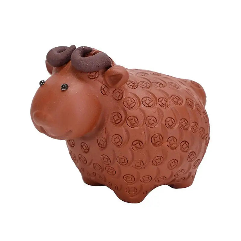 Brown ceramic sheep figurine from Peaceful Ram, a Zisha clay tea pets guide for feng shui