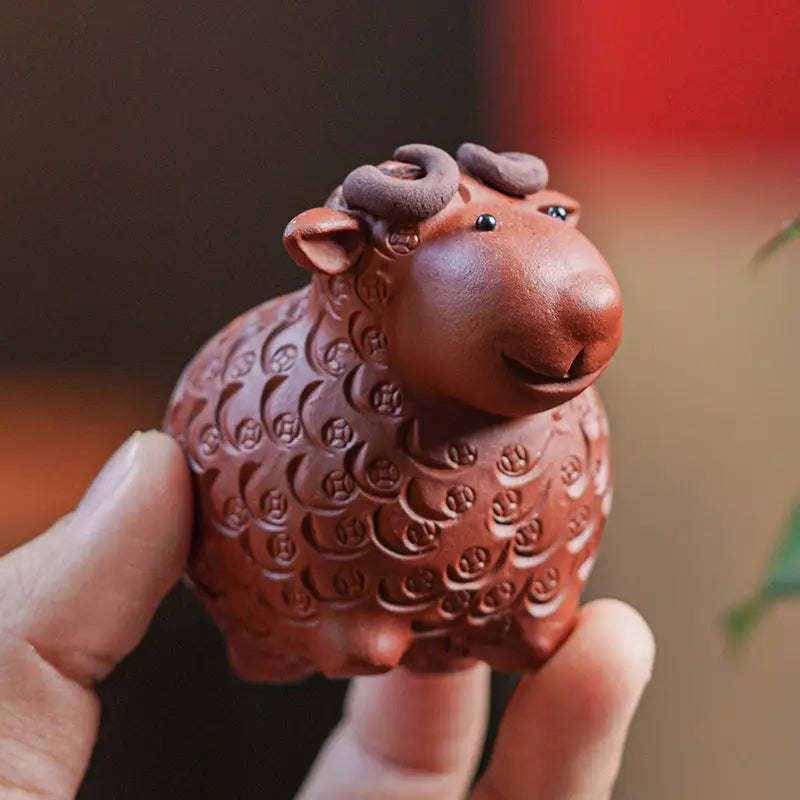 Brown ceramic sheep figurine from Peaceful Ram, perfect as a tea pets guide with zisha clay for feng shui