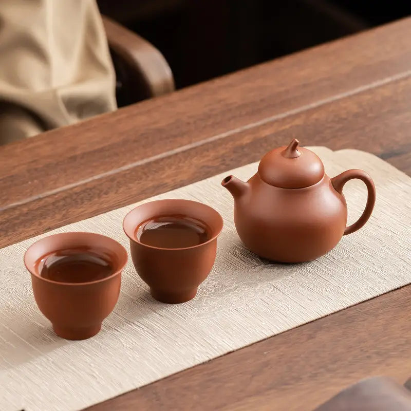 Earthenware Pearlight Yixing Zisha tea set with teapot and teacups on Zisha clay