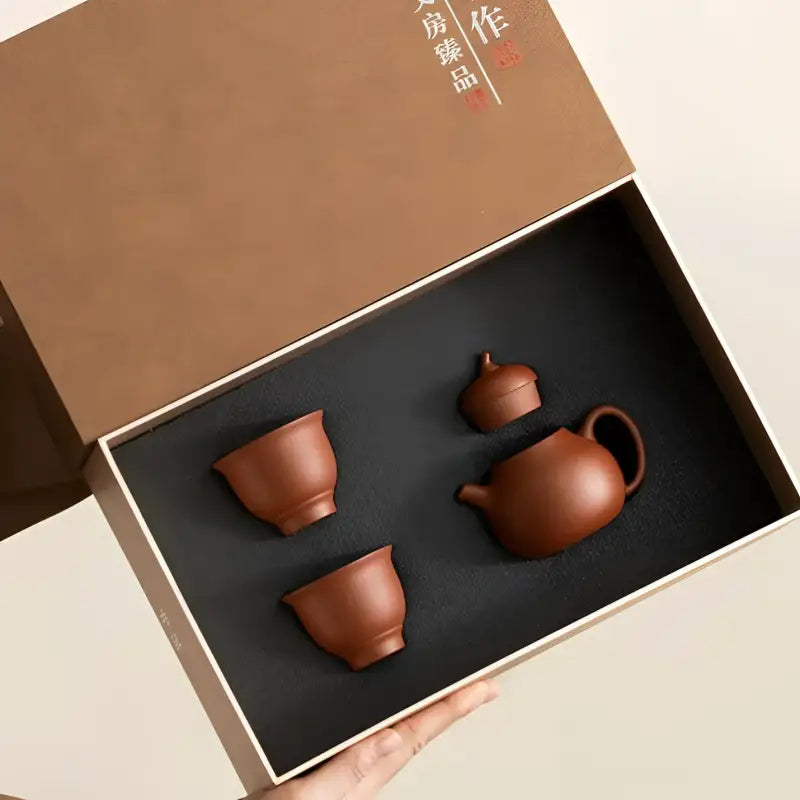 Pearlight Yixing Zisha Tea Set in gift box showcasing traditional Zisha clay craftsmanship