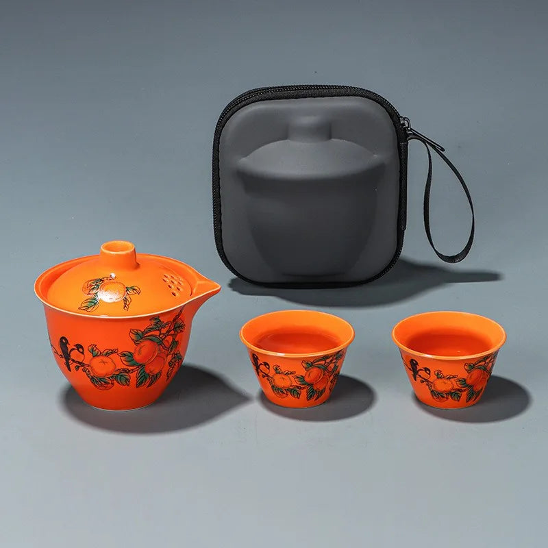 Orange persimmon porcelain travel tea set with filter teapot, two cups and zip case – photo 1