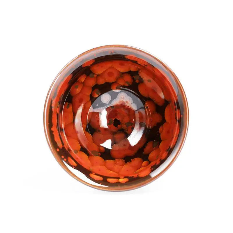Red and black patterned ceramic bowl from Phoenix Jian Zhan collection with volcanic glaze