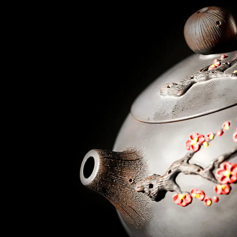 Ornate brown Yixing Zisha teapot with floral design from Plum Blossom collection
