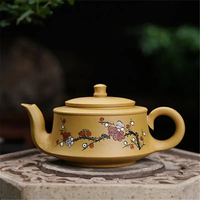 Floral-painted yellow teapot from Plum Flower tea set, ideal for teapots and mugs brewing