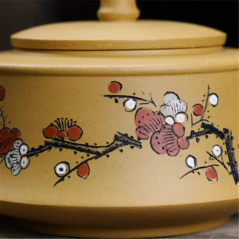 Tan ceramic jar with floral design for tea sets and mugs in the Plum Flower collection