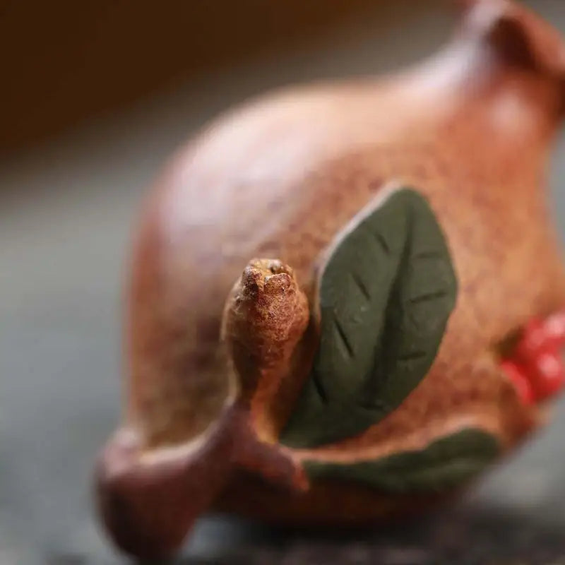 Ceramic pomegranate figurine tea pet from Pomegranate Blessing for feng shui decor