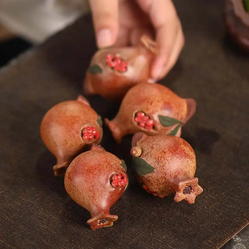 Miniature pomegranate-shaped ceramic ornaments for Pomegranate Blessing, ideal as feng shui tea pets