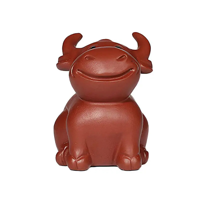 Brown ceramic bull figurine Prosperhorn tea pet guide Yixing Zisha feng shui earth element
