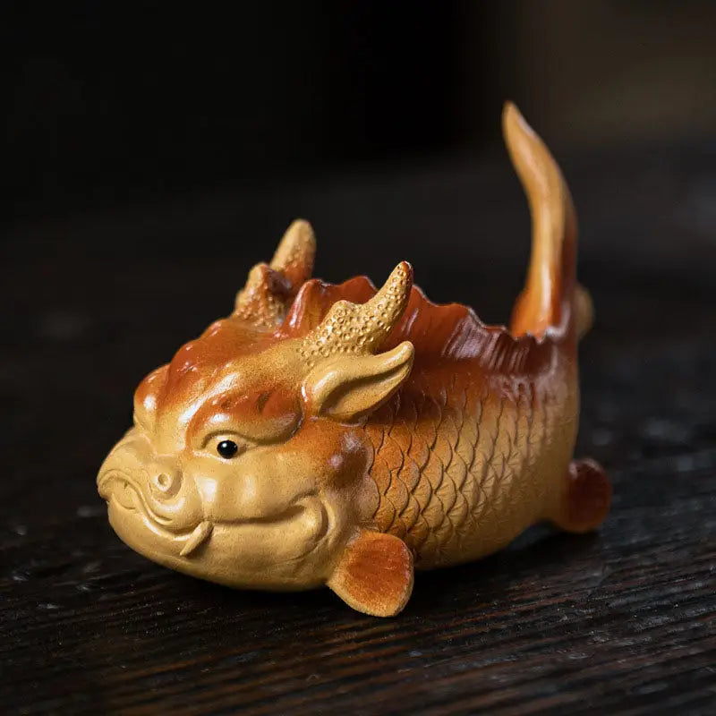 Whimsical fish-dragon figurine from Prosperity Fish, a fish tea pet for feng shui good fortune