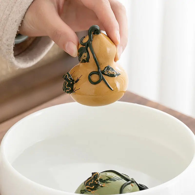 Prosperity Gourd tea pet made of Yixing clay with frog and vine details for tea pets guide