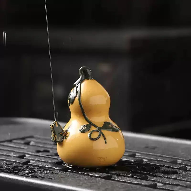 Yellow Prosperity Gourd tea pet with black vine design made from Yixing clay