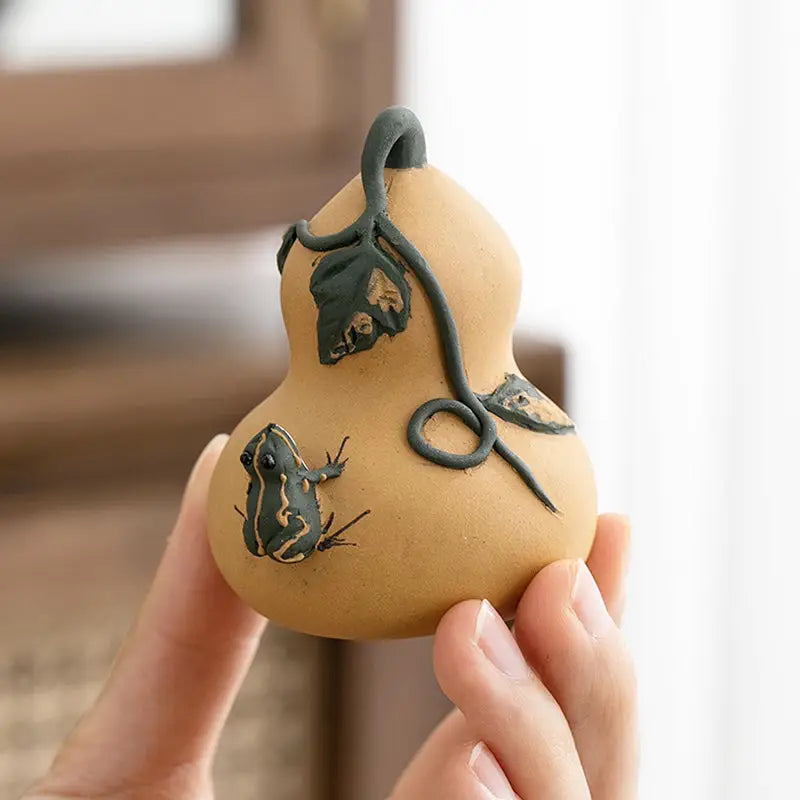 Handcrafted Prosperity Gourd tea pet with frog and vine details in Yixing clay
