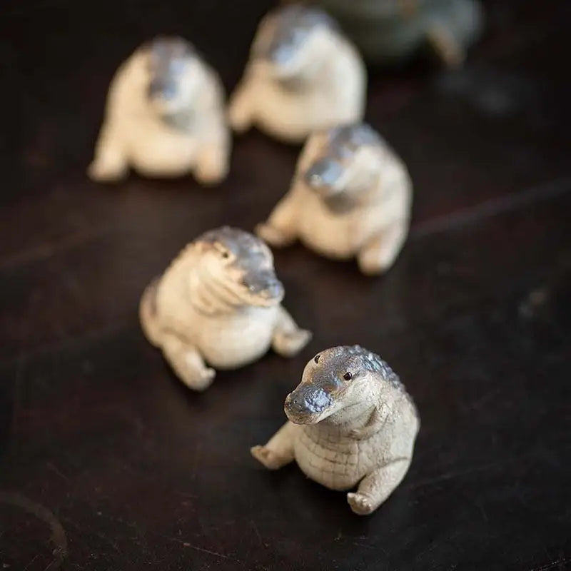Small ceramic alligator tea pets from the Prosperous Alligator collection, perfect for tea pets guide