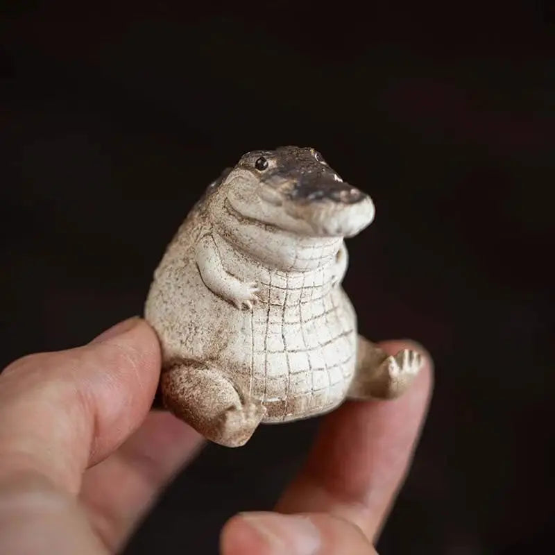 Chubby ceramic alligator figurine from Prosperous Alligator tea pets guide, perfect as an alligator tea pet