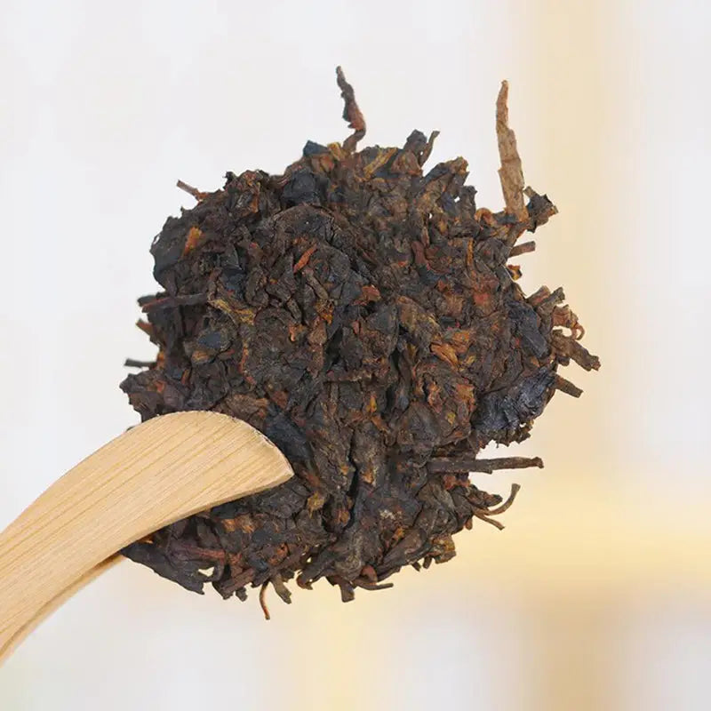 Dark compressed Pu’er Tea Cake ideal for tea sets and teapots display