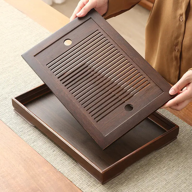 Dark brown wooden tea tray with slotted top from Quiet Stream Bamboo Tea Tray collection