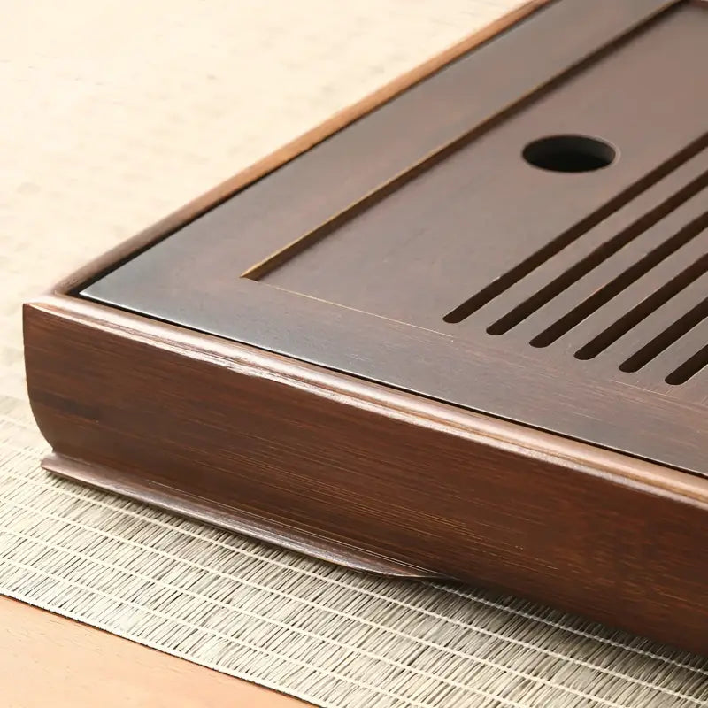 Dark wooden tea tray from Quiet Stream featuring a compact bamboo tea tray design
