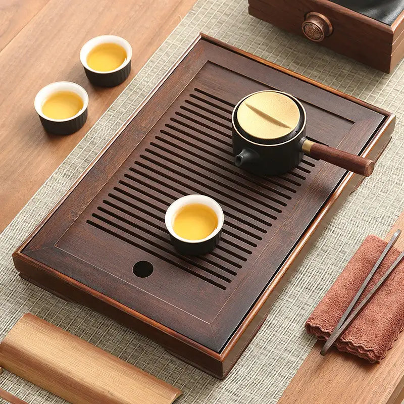 Dark wooden tea tray with accessories from Quiet Stream Compact Bamboo Tea Tray collection