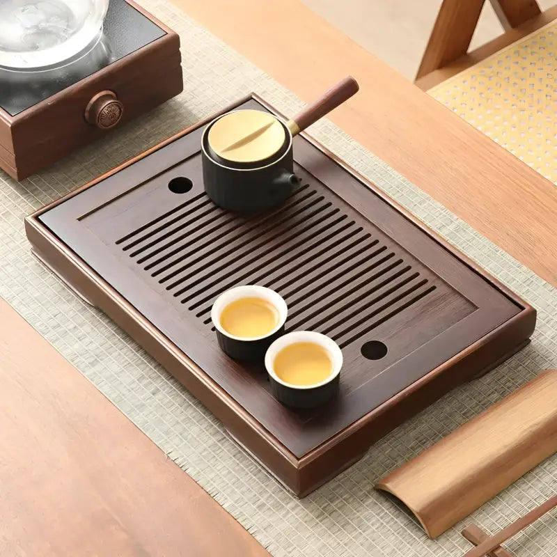 Wooden tea tray with tea set on Quiet Stream Compact Bamboo Tea Tray for elegant serving