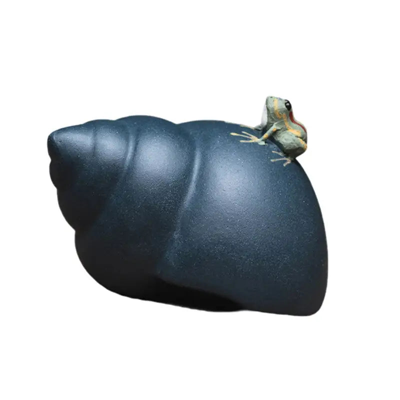 Dark snail shell with Raincaller Frog teapot accessory, ideal for tea pets guide enthusiasts