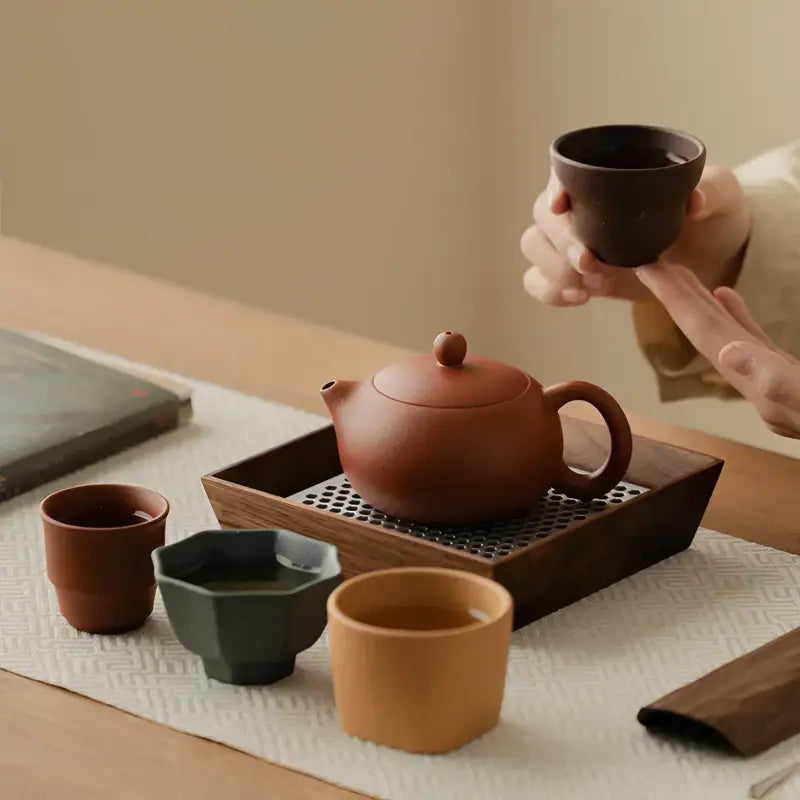 Red Harmony earthenware tea set with Yixing Zisha teapot for traditional tea brewing