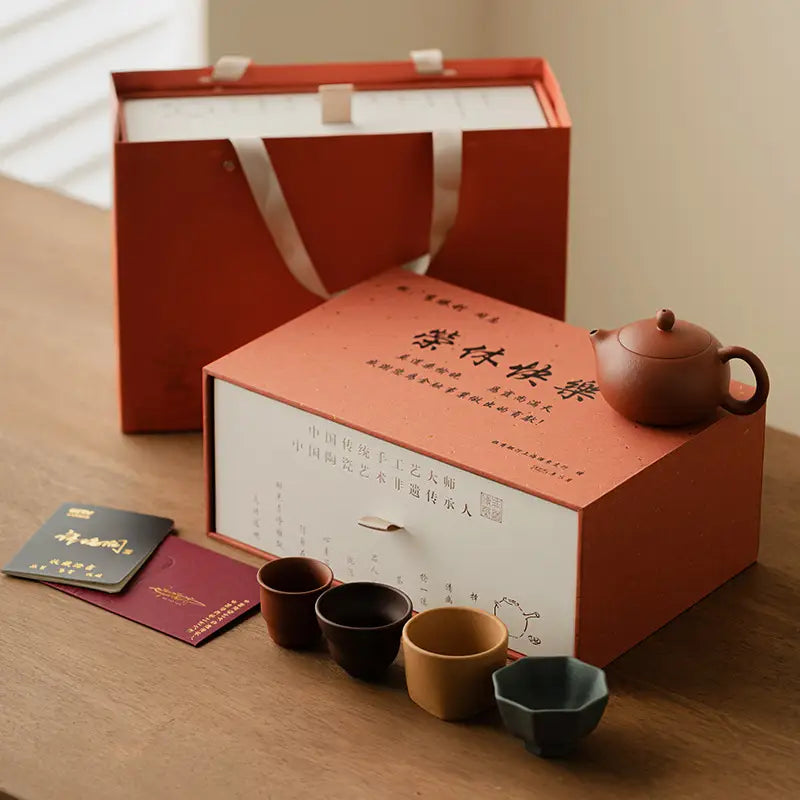 Tea set in gift packaging featuring Red Harmony Yixing Zisha Teapot and accessories