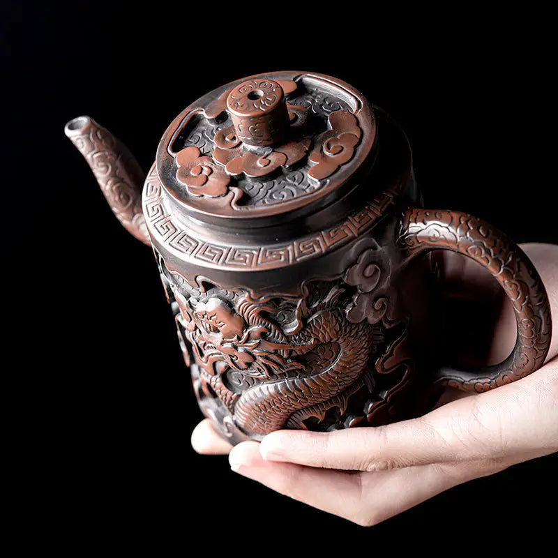 Ornate bronze relief dragon teapot with Jianshui Zitao clay design, perfect for collectors