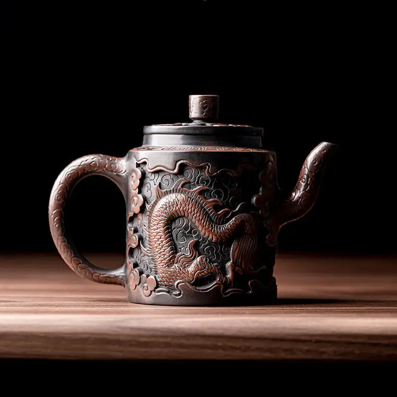 Ornate relief dragon teapot crafted from Jianshui Zitao clay featuring intricate dragon design