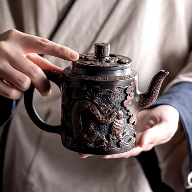 Ornate Relief Dragon Teapot crafted from Jianshui Zitao clay, perfect for dragon teapot lovers