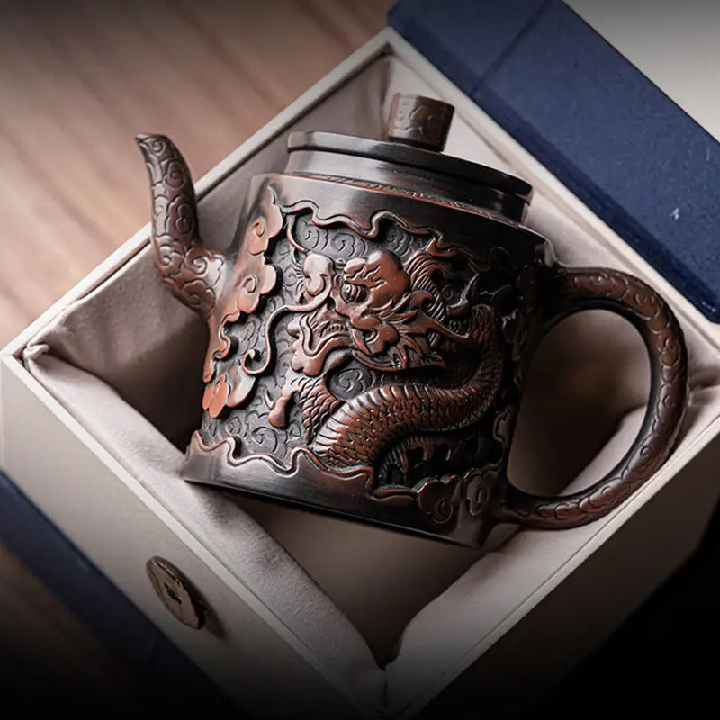 Ornate relief dragon teapot in presentation box made from Jianshui Zitao clay featuring dragon design