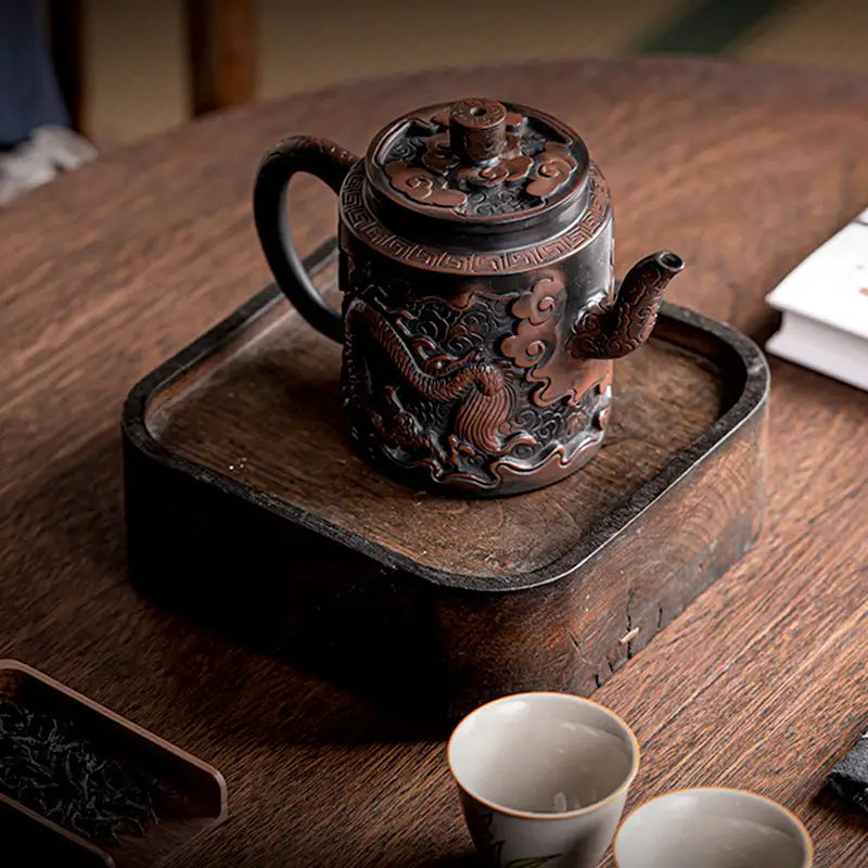 Ornate Relief Dragon teapot made from Jianshui Zitao clay, a stunning dragon teapot display