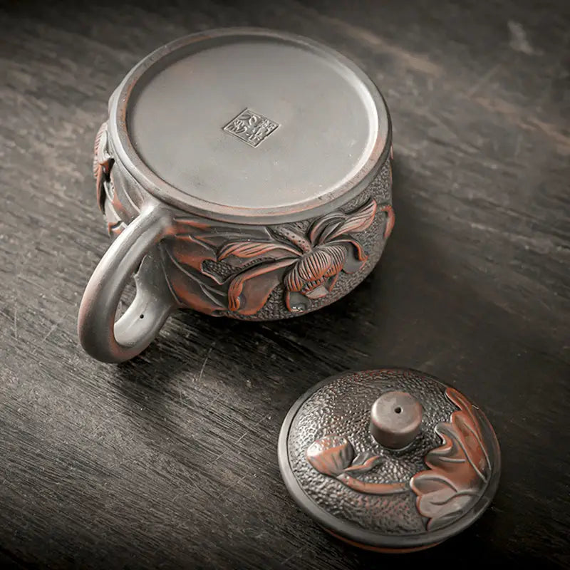 Relief Lotus Jianshui Zitao black clay ceramic teapot with floral relief design
