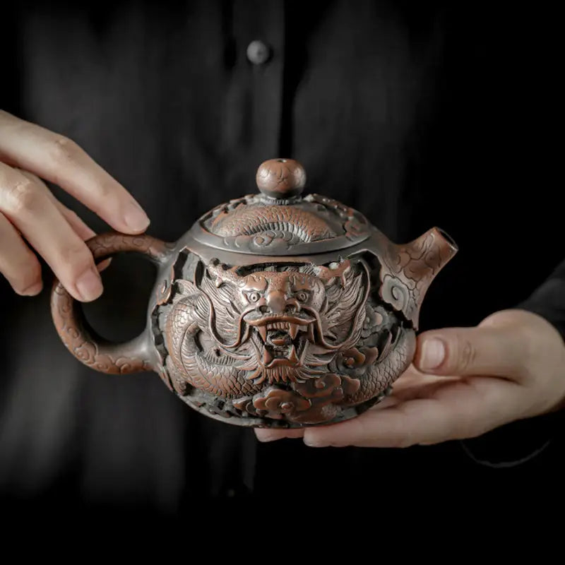 Ornate Jianshui Zitao teapot with hand-carved dragon design in Jianshui purple, Roaring Dragon