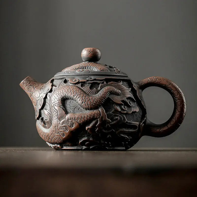 Ornate jianshui zitao teapot with hand-carved dragon design in jianshui purple for Roaring Dragon
