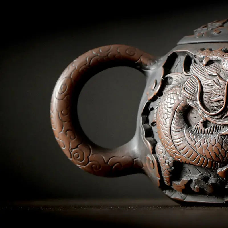 Ornate Jianshui Zitao teapot with hand-carved dragon design from Roaring Dragon collection