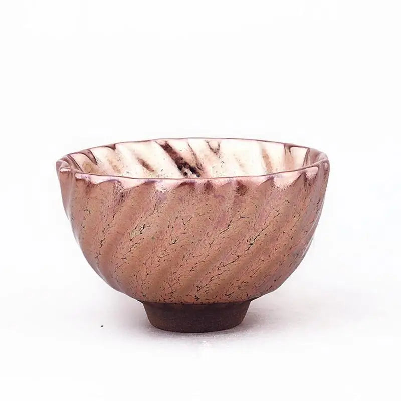 Textured rose-colored ceramic bowl with tenmoku glaze in Rose Gold Jian Zhan tea cup style