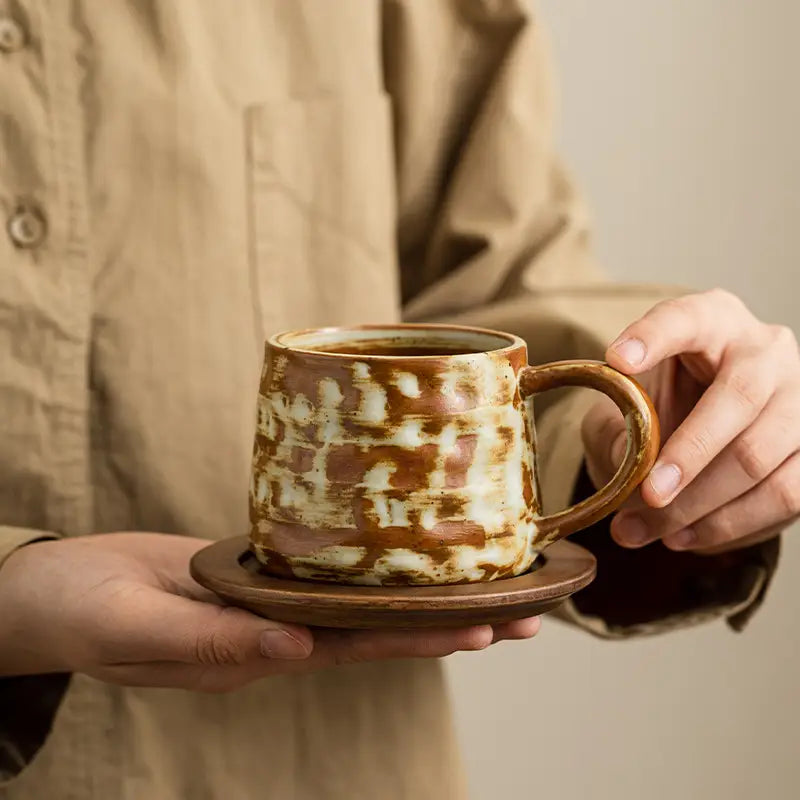 Brown and white handmade Dehua ceramic mug on a wood saucer for Rust Coffee Cup