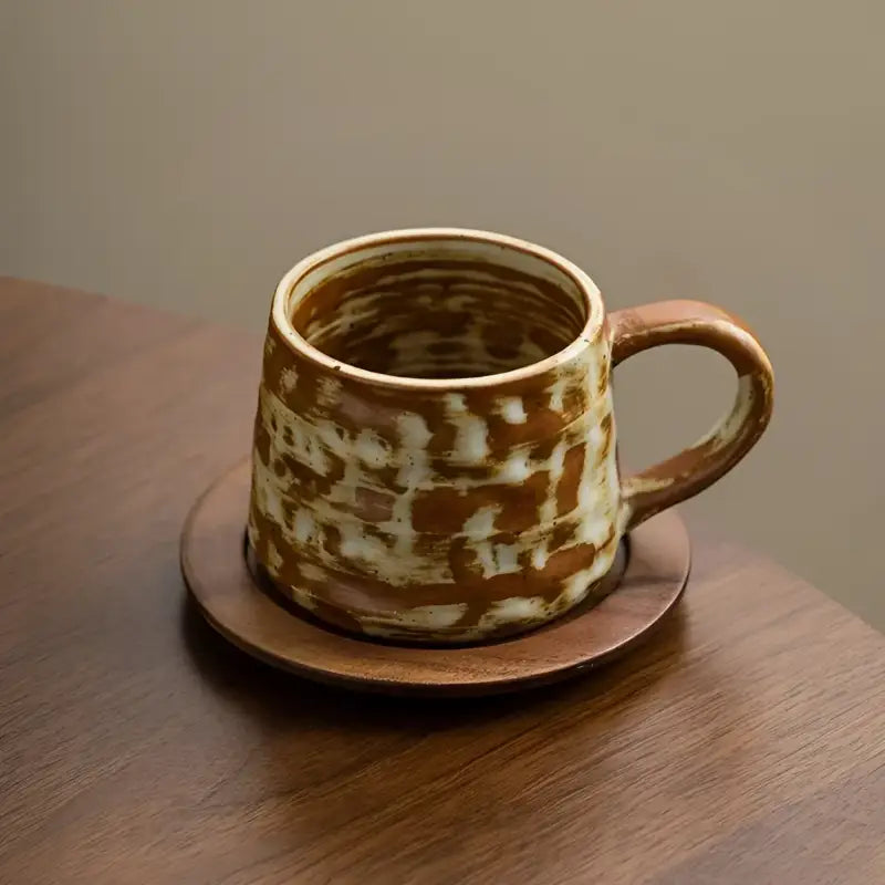 Brown and white handmade Dehua ceramic Rust Coffee Cup with unique oxidation on wood saucer