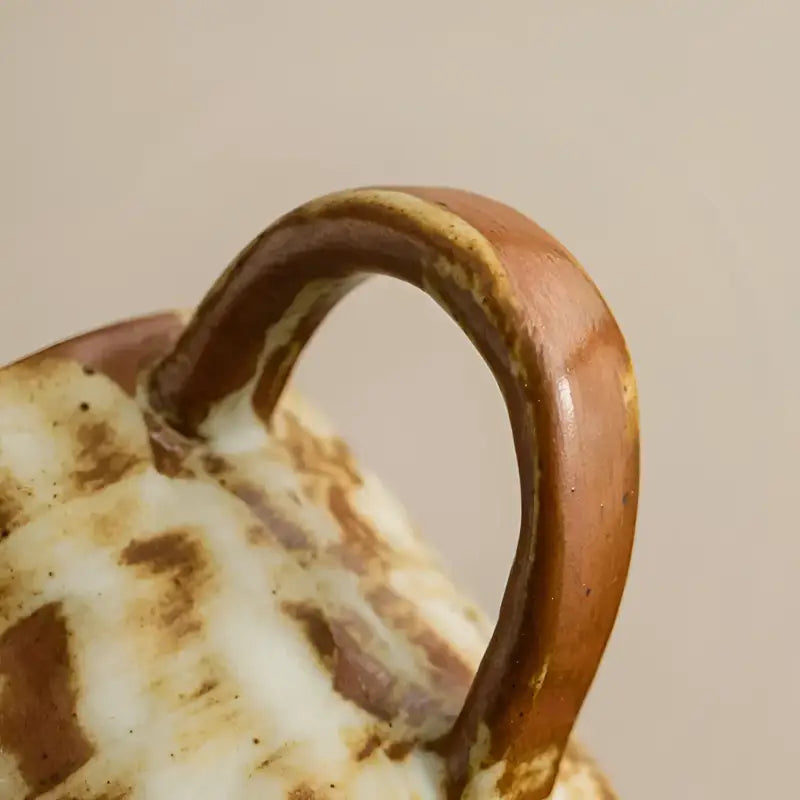 Ceramic mug handle with brown and cream glaze on Rust Coffee Cup, handmade Dehua ceramic with unique oxidation and wood saucer