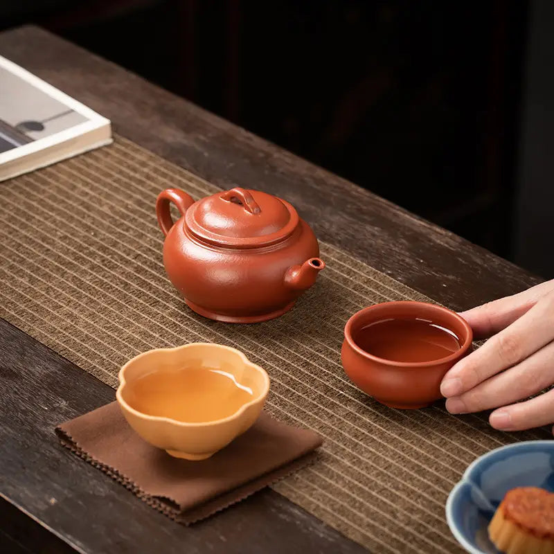 Earthenware tea set from Scarlet Harmony featuring handmade Zhu clay craftsmanship