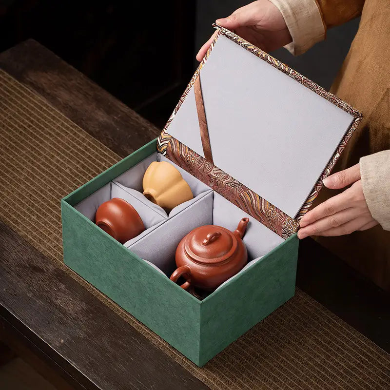 Scarlet Harmony Tea Sets in a green box featuring handmade Zhu Clay tea ware