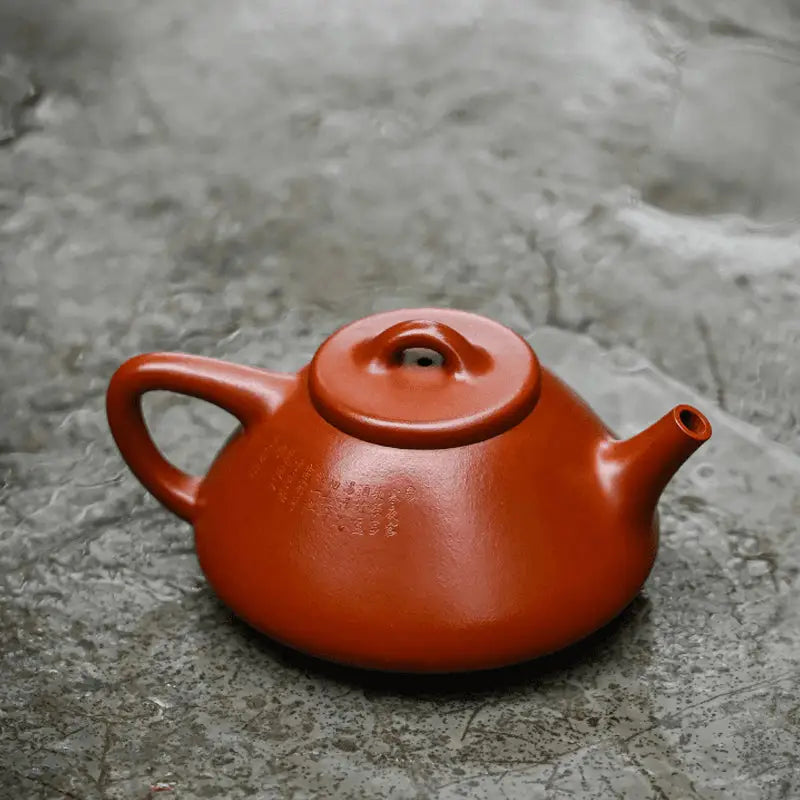 Red-brown Yixing teapot made from Zhuni clay for authentic Gongfu tea brewing
