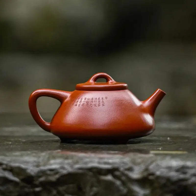 Reddish-brown Yixing teapot made from Zhuni clay for Gongfu tea brewing