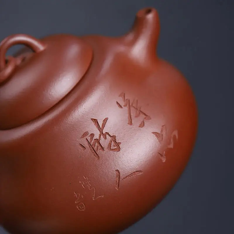 Reddish-brown handcrafted Yixing Zisha teapot with carved inscription Scholar’s Rest